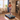 A woman runs on a UREVO CyberPad for Home Treadmill in a cozy, well-lit living room.